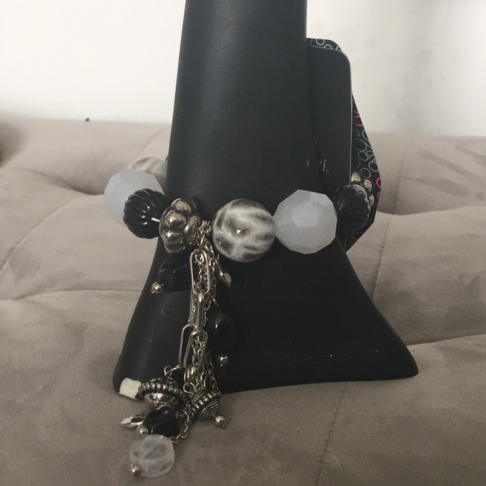 Black, Silver, and White dangling charm bracelet.